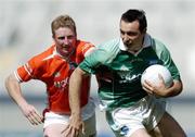 7 August 2004; Stephen Maguire, Fermanagh, in action against Francie Bellew, Armagh. Bank of Ireland All-Ireland Senior Football Championship Quarter Final, Armagh v Fermanagh, Croke Park, Dublin. Picture credit; Brendan Moran / SPORTSFILE