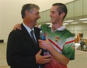 25 September 2004; Mayo's Joe McCann is congratulated by Handball president Tony Hayes after  victory over Tyrone's Niall Kerr. Coca Cola All-Ireland 60x30 Handball Finals, Intermediate Singles, Joe McCann, Mayo v Niall Kerr, Tyrone, Croke Park, Dublin. Picture credit; Pat Murphy / SPORTSFILE