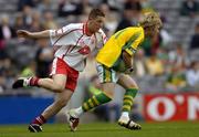26 September 2004; Brendan Kealy, Kerry, in action against Ronan McRory, Tyrone. All-Ireland Minor Football Championship Final, Kerry v Tyrone, Croke Park, Dublin. Picture credit; Brian Lawless / SPORTSFILE *** Local Caption *** Any photograph taken by SPORTSFILE during, or in connection with, the 2004 All-Ireland Minor Football Final which displays GAA logos or contains an image or part of an image of any GAA intellectual property, or, which contains images of a GAA player/players in their playing uniforms, may only be used for editorial and non-advertising purposes.  Use of photographs for advertising, as posters or for purchase separately is strictly prohibited unless prior written approval has been obtained from the Gaelic Athletic Association.