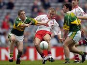 26 September 2004; Cathal O'Neill, Tyrone, in action against Killian Young, left, and Ciaran Kelliher, Kerry. All-Ireland Minor Football Championship Final, Kerry v Tyrone, Croke Park, Dublin. Picture credit; Brian Lawless / SPORTSFILE *** Local Caption *** Any photograph taken by SPORTSFILE during, or in connection with, the 2004 All-Ireland Minor Football Final which displays GAA logos or contains an image or part of an image of any GAA intellectual property, or, which contains images of a GAA player/players in their playing uniforms, may only be used for editorial and non-advertising purposes.  Use of photographs for advertising, as posters or for purchase separately is strictly prohibited unless prior written approval has been obtained from the Gaelic Athletic Association.