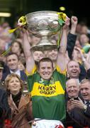 26 September 2004; Kerry captain Dara O Cinneide lifts the Sam Maguire cup after victory over Mayo. Bank of Ireland All-Ireland Senior Football Championship Final, Kerry v Mayo, Croke Park, Dublin. Picture credit; Brendan Moran / SPORTSFILE *** Local Caption *** Any photograph taken by SPORTSFILE during, or in connection with, the 2004 Bank of Ireland All-Ireland Senior Football Final which displays GAA logos or contains an image or part of an image of any GAA intellectual property, or, which contains images of a GAA player/players in their playing uniforms, may only be used for editorial and non-advertising purposes.  Use of photographs for advertising, as posters or for purchase separately is strictly prohibited unless prior written approval has been obtained from the Gaelic Athletic Association.