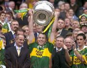 26 September 2004; Kerry's Seamus Moynihan lifts the Sam Maguire cup after victory over Mayo. Bank of Ireland All-Ireland Senior Football Championship Final, Kerry v Mayo, Croke Park, Dublin. Picture credit; Brendan Moran / SPORTSFILE *** Local Caption *** Any photograph taken by SPORTSFILE during, or in connection with, the 2004 Bank of Ireland All-Ireland Senior Football Final which displays GAA logos or contains an image or part of an image of any GAA intellectual property, or, which contains images of a GAA player/players in their playing uniforms, may only be used for editorial and non-advertising purposes.  Use of photographs for advertising, as posters or for purchase separately is strictly prohibited unless prior written approval has been obtained from the Gaelic Athletic Association.