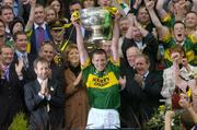 26 September 2004; Kerry captain Dara O Cinneide lifts the Sam Maguire Cup. Bank of Ireland All-Ireland Senior Football Championship Final, Kerry v Mayo, Croke Park, Dublin. Picture credit; Ray McManus / SPORTSFILE *** Local Caption *** Any photograph taken by SPORTSFILE during, or in connection with, the 2004 Bank of Ireland All-Ireland Senior Football Final which displays GAA logos or contains an image or part of an image of any GAA intellectual property, or, which contains images of a GAA player/players in their playing uniforms, may only be used for editorial and non-advertising purposes.  Use of photographs for advertising, as posters or for purchase separately is strictly prohibited unless prior written approval has been obtained from the Gaelic Athletic Association.