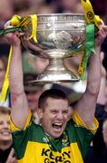 26 September 2004; Kerry captain Dara O'Cinneide lifts the Sam Maguire Cup. Bank of Ireland All-Ireland Senior Football Championship Final, Kerry v Mayo, Croke Park, Dublin. Picture credit; Damien Eagers / SPORTSFILE *** Local Caption *** Any photograph taken by SPORTSFILE during, or in connection with, the 2004 Bank of Ireland All-Ireland Senior Football Final which displays GAA logos or contains an image or part of an image of any GAA intellectual property, or, which contains images of a GAA player/players in their playing uniforms, may only be used for editorial and non-advertising purposes.  Use of photographs for advertising, as posters or for purchase separately is strictly prohibited unless prior written approval has been obtained from the Gaelic Athletic Association.