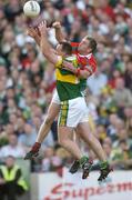 26 September 2004; Gary Ruane, Mayo, in action against John Crowley, Kerry. Bank of Ireland All-Ireland Senior Football Championship Final, Kerry v Mayo, Croke Park, Dublin. Picture credit; Ray McManus / SPORTSFILE *** Local Caption *** Any photograph taken by SPORTSFILE during, or in connection with, the 2004 Bank of Ireland All-Ireland Senior Football Final which displays GAA logos or contains an image or part of an image of any GAA intellectual property, or, which contains images of a GAA player/players in their playing uniforms, may only be used for editorial and non-advertising purposes.  Use of photographs for advertising, as posters or for purchase separately is strictly prohibited unless prior written approval has been obtained from the Gaelic Athletic Association.