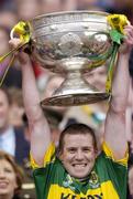 26 September 2004; Kerry captain Dara O'Cinneide lifts the Sam Maguire Cup. Bank of Ireland All-Ireland Senior Football Championship Final, Kerry v Mayo, Croke Park, Dublin. Picture credit; Damien Eagers / SPORTSFILE *** Local Caption *** Any photograph taken by SPORTSFILE during, or in connection with, the 2004 Bank of Ireland All-Ireland Senior Football Final which displays GAA logos or contains an image or part of an image of any GAA intellectual property, or, which contains images of a GAA player/players in their playing uniforms, may only be used for editorial and non-advertising purposes.  Use of photographs for advertising, as posters or for purchase separately is strictly prohibited unless prior written approval has been obtained from the Gaelic Athletic Association.