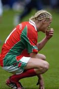 26 September 2004; A dejected Ciaran McDonald, Mayo, after defeat to Kerry. Bank of Ireland All-Ireland Senior Football Championship Final, Kerry v Mayo, Croke Park, Dublin. Picture credit; Brian Lawless / SPORTSFILE *** Local Caption *** Any photograph taken by SPORTSFILE during, or in connection with, the 2004 Bank of Ireland All-Ireland Senior Football Final which displays GAA logos or contains an image or part of an image of any GAA intellectual property, or, which contains images of a GAA player/players in their playing uniforms, may only be used for editorial and non-advertising purposes.  Use of photographs for advertising, as posters or for purchase separately is strictly prohibited unless prior written approval has been obtained from the Gaelic Athletic Association.