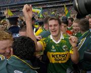 26 September 2004; Kerry's Eoin Brosnan celebrates after victory over Mayo. Bank of Ireland All-Ireland Senior Football Championship Final, Kerry v Mayo, Croke Park, Dublin. Picture credit; Brendan Moran / SPORTSFILE *** Local Caption *** Any photograph taken by SPORTSFILE during, or in connection with, the 2004 Bank of Ireland All-Ireland Senior Football Final which displays GAA logos or contains an image or part of an image of any GAA intellectual property, or, which contains images of a GAA player/players in their playing uniforms, may only be used for editorial and non-advertising purposes.  Use of photographs for advertising, as posters or for purchase separately is strictly prohibited unless prior written approval has been obtained from the Gaelic Athletic Association.