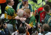 26 September 2004; Colm Cooper, Kerry, is congratulated after victory over Mayo. Bank of Ireland All-Ireland Senior Football Championship Final, Kerry v Mayo, Croke Park, Dublin. Picture credit; Pat Murphy / SPORTSFILE *** Local Caption *** Any photograph taken by SPORTSFILE during, or in connection with, the 2004 Bank of Ireland All-Ireland Senior Football Final which displays GAA logos or contains an image or part of an image of any GAA intellectual property, or, which contains images of a GAA player/players in their playing uniforms, may only be used for editorial and non-advertising purposes.  Use of photographs for advertising, as posters or for purchase separately is strictly prohibited unless prior written approval has been obtained from the Gaelic Athletic Association.