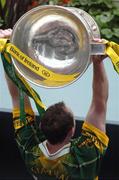 26 September 2004; Seamus Moynihan, Kerry, lifts the Sam Maguire cup. Bank of Ireland All-Ireland Senior Football Championship Final, Kerry v Mayo, Croke Park, Dublin. Picture credit; Pat Murphy / SPORTSFILE *** Local Caption *** Any photograph taken by SPORTSFILE during, or in connection with, the 2004 Bank of Ireland All-Ireland Senior Football Final which displays GAA logos or contains an image or part of an image of any GAA intellectual property, or, which contains images of a GAA player/players in their playing uniforms, may only be used for editorial and non-advertising purposes.  Use of photographs for advertising, as posters or for purchase separately is strictly prohibited unless prior written approval has been obtained from the Gaelic Athletic Association.