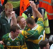 26 September 2004; Colm Cooper, Kerry, and team-mate Michael Quirke, right, celebrate victory over Mayo. Bank of Ireland All-Ireland Senior Football Championship Final, Kerry v Mayo, Croke Park, Dublin. Picture credit; Pat Murphy / SPORTSFILE *** Local Caption *** Any photograph taken by SPORTSFILE during, or in connection with, the 2004 Bank of Ireland All-Ireland Senior Football Final which displays GAA logos or contains an image or part of an image of any GAA intellectual property, or, which contains images of a GAA player/players in their playing uniforms, may only be used for editorial and non-advertising purposes.  Use of photographs for advertising, as posters or for purchase separately is strictly prohibited unless prior written approval has been obtained from the Gaelic Athletic Association.