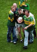 26 September 2004; Tomas O'Se, Kerry, is congratulated by supporters after victory over Mayo. Bank of Ireland All-Ireland Senior Football Championship Final, Kerry v Mayo, Croke Park, Dublin. Picture credit; Pat Murphy / SPORTSFILE *** Local Caption *** Any photograph taken by SPORTSFILE during, or in connection with, the 2004 Bank of Ireland All-Ireland Senior Football Final which displays GAA logos or contains an image or part of an image of any GAA intellectual property, or, which contains images of a GAA player/players in their playing uniforms, may only be used for editorial and non-advertising purposes.  Use of photographs for advertising, as posters or for purchase separately is strictly prohibited unless prior written approval has been obtained from the Gaelic Athletic Association.