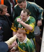 26 September 2004; Seamus Moynihan and Noel Kennelly, bottom, Kerry, celebrate victory over Mayo. Bank of Ireland All-Ireland Senior Football Championship Final, Kerry v Mayo, Croke Park, Dublin. Picture credit; Pat Murphy / SPORTSFILE *** Local Caption *** Any photograph taken by SPORTSFILE during, or in connection with, the 2004 Bank of Ireland All-Ireland Senior Football Final which displays GAA logos or contains an image or part of an image of any GAA intellectual property, or, which contains images of a GAA player/players in their playing uniforms, may only be used for editorial and non-advertising purposes.  Use of photographs for advertising, as posters or for purchase separately is strictly prohibited unless prior written approval has been obtained from the Gaelic Athletic Association.