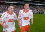 26 September 2004; Tyrone's Niall Kerr, left, and Shane O'Hagan show their emotions after victory over Kerry. All-Ireland Minor Football Championship Final, Kerry v Tyrone, Croke Park, Dublin. Picture credit; Brian Lawless / SPORTSFILE *** Local Caption *** Any photograph taken by SPORTSFILE during, or in connection with, the 2004 All-Ireland Minor Football Final which displays GAA logos or contains an image or part of an image of any GAA intellectual property, or, which contains images of a GAA player/players in their playing uniforms, may only be used for editorial and non-advertising purposes.  Use of photographs for advertising, as posters or for purchase separately is strictly prohibited unless prior written approval has been obtained from the Gaelic Athletic Association.