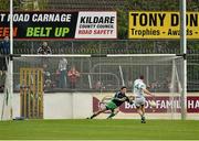 13 October 2013; Patrick O'Sullivan, Sarsfields, dives to save a penalty from Ronan Sweeney, Moorefield. Kildare County Senior Club Football Championship Final, Sarsfields v Moorefield, St Conleth's Park, Newbridge, Co. Kildare. Picture credit: Barry Cregg / SPORTSFILE