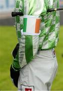 14 October 2013; Jockey Bryan Cooper wears a tri-colour armband before competing in the 'Rite of Passage' Britain v Ireland Riders Challenge Maiden Hurdle at the Limerick Charity Race Day for the jockeys emergency fund. Limerick Racecourse, Greenmount Park, Co. Limerick. Picture credit: Diarmuid Greene / SPORTSFILE