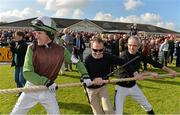 14 October 2013; Jockeys Tony McCoy, left, Paul Carbery, centre, and Ruby Walsh prepare to get a tug-of-war match underway at the Limerick Charity Race Day for the jockeys emergency fund. Limerick Racecourse, Greenmount Park, Co. Limerick. Picture credit: Diarmuid Greene / SPORTSFILE