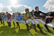 14 October 2013; Jockeys compete in a tug-of-war match at the Limerick Charity Race Day for the jockeys emergency fund. Limerick Racecourse, Greenmount Park, Co. Limerick. Picture credit: Diarmuid Greene / SPORTSFILE
