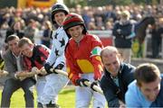 14 October 2013; Jockeys, including Adrian Heskin, centre, compete in a tug-of-war match at the Limerick Charity Race Day for the jockeys emergency fund. Limerick Racecourse, Greenmount Park, Co. Limerick. Picture credit: Diarmuid Greene / SPORTSFILE