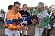 14 October 2013; Jockey Johnny Murtagh is carried towards a water trough by fellow jockeys, Davy Russell, left, Tony McCoy, centre, and Ruby Walsh, right, after winning the Betfair Cash Out Flat & National Hunt Champion Jockeys Handicap on Goal at the Limerick Charity Race Day for the jockeys emergency fund. Limerick Racecourse, Greenmount Park, Co. Limerick. Picture credit: Diarmuid Greene / SPORTSFILE
