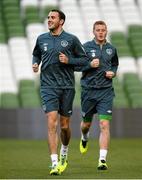 14 October 2013; Republic of Ireland's John O'Shea, left, and James McCarthy in action during squad training ahead of their 2014 FIFA World Cup Qualifier, Group C, game against Kazakhstan on Tuesday. Republic of Ireland Squad Training, Aviva Stadium, Lansdowne Road, Dublin. Picture credit: David Maher / SPORTSFILE