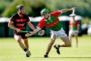 21 June 2025; Billy Mehigan of Ballinora in action against Dara Cunningham of Ballygunner during the Hurling Division 1 Final match between Ballygunner and Ballinora during the John West Féile na nGael Camogie and Hurling National Finals at Halo Tiles Wexford GAA Centre of Excellence in Ferns, Wexford. Photo by Shauna Clinton/Sportsfile