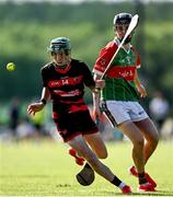 21 June 2025; Michael Moloney of Ballygunner in action against Charlie Noonan of Ballinora during the Hurling Division 1 Final match between Ballygunner and Ballinora during the John West Féile na nGael Camogie and Hurling National Finals at Halo Tiles Wexford GAA Centre of Excellence in Ferns, Wexford. Photo by Shauna Clinton/Sportsfile