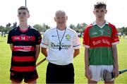 21 June 2025; Ballygunner captain Michael Moloney, left, and Ballinora captain Charlier Noonan, right, join referee Kevin Keogh for the coin toss before the Hurling Division 1 Final match between Ballygunner and Ballinora during the John West Féile na nGael Camogie and Hurling National Finals at Halo Tiles Wexford GAA Centre of Excellence in Ferns, Wexford. Photo by Shauna Clinton/Sportsfile