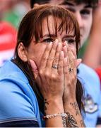 21 June 2025; A Dublin supporter watches on in the final moments of the GAA Hurling All-Ireland Senior Championship quarter-final match between Dublin and Limerick at Croke Park in Dublin. Photo by Ramsey Cardy/Sportsfile