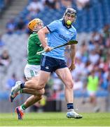 21 June 2025; Ronan Hayes of Dublin in action against Adam English of Limerick during the GAA Hurling All-Ireland Senior Championship quarter-final match between Dublin and Limerick at Croke Park in Dublin. Photo by Ramsey Cardy/Sportsfile