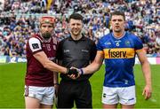 21 June 2025; Referee Sean Stack with the two captains, Conor Whelan of Galway and Ronan Maher of Tipperary, before the GAA Hurling All-Ireland Senior Championship quarter-final match between Galway and Tipperary at TUS Gaelic Grounds in Limerick. Photo by Ray McManus/Sportsfile