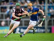 21 June 2025; Cianan Fahy of Galway in action against Jake Morris of Tipperary during the GAA Hurling All-Ireland Senior Championship quarter-final match between Galway and Tipperary at TUS Gaelic Grounds in Limerick. Photo by Ray McManus/Sportsfile