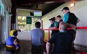 21 June 2025; Member of the press, GAA officials and a Tipperary supporter watch the broadcast of the Dublin v Limerick - GAA Hurling All-Ireland Senior Championship Quarter-Final in the press area before the GAA Hurling All-Ireland Senior Championship quarter-final match between Galway and Tipperary at TUS Gaelic Grounds in Limerick. Photo by Ray McManus/Sportsfile