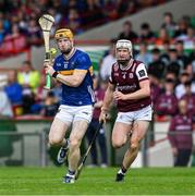 21 June 2025; Jake Morris of Tipperary in action against Darren Morrissey of Galway during the GAA Hurling All-Ireland Senior Championship quarter-final match between Galway and Tipperary at TUS Gaelic Grounds in Limerick. Photo by Ray McManus/Sportsfile