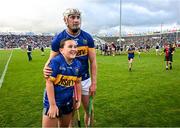 21 June 2025; Eoghan Connolly of Tipperary with a young supporter after the GAA Hurling All-Ireland Senior Championship quarter-final match between Galway and Tipperary at TUS Gaelic Grounds in Limerick. Photo by Ray McManus/Sportsfile