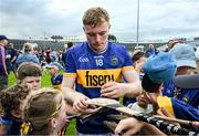 21 June 2025; Sean Kenneally of Tipperary signs autographs after  the GAA Hurling All-Ireland Senior Championship quarter-final match between Galway and Tipperary at TUS Gaelic Grounds in Limerick. Photo by Ray McManus/Sportsfile