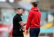 13 June 2025; Shamrock Rovers strength and conditioning coach Darren Dillon, left, and Sean Boyd of Shelbourne before the SSE Airtricity Men's Premier Division match between Shelbourne and Shamrock Rovers at Tolka Park in Dublin. Photo by Stephen McCarthy/Sportsfile