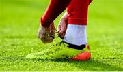 13 June 2025; A Shelbourne player ties his laces during the SSE Airtricity Men's Premier Division match between Shelbourne and Shamrock Rovers at Tolka Park in Dublin. Photo by Stephen McCarthy/Sportsfile