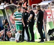 13 June 2025; Adam Matthews of Shamrock Rovers with staff, from left, manager Stephen Bradley, strength and conditioning coach Darren Dillon and sporting director Stephen McPhail after leaving the game with an injury during the SSE Airtricity Men's Premier Division match between Shelbourne and Shamrock Rovers at Tolka Park in Dublin. Photo by Stephen McCarthy/Sportsfile