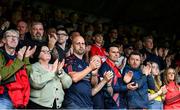 13 June 2025; Shelbourne supporters during a moments applause in memory of the late Siobhan Clancy, mother of Shelbourne player Aoibheann Clancy, before the SSE Airtricity Men's Premier Division match between Shelbourne and Shamrock Rovers at Tolka Park in Dublin. Photo by Stephen McCarthy/Sportsfile