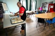 22 June 2025; Down coaching officer Paddy Hardy prepares the sandwich trays before the GAA Football All-Ireland Senior Championship preliminary quarter-final match between Down and Galway at Páirc Esler in Newry, Down. Photo by Ben McShane/Sportsfile