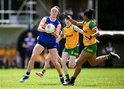 21 June 2025; Aishling Moloney of Tipperary in action against Abigail Temple Asokuh of Donegal during the TG4 All-Ireland Ladies Football Senior Championship Group 1 match between Tipperary and Donegal at Canon Hayes Park in Bansha, Tipperary. Photo by Seb Daly/Sportsfile