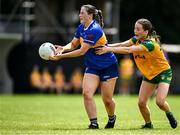 21 June 2025; Lucy Spillane of Tipperary in action against Katie Dowds of Donegal during the TG4 All-Ireland Ladies Football Senior Championship Group 1 match between Tipperary and Donegal at Canon Hayes Park in Bansha, Tipperary. Photo by Seb Daly/Sportsfile