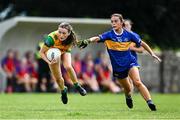 21 June 2025; Katie Dowds of Donegal in action against Clara English of Tipperary during the TG4 All-Ireland Ladies Football Senior Championship Group 1 match between Tipperary and Donegal at Canon Hayes Park in Bansha, Tipperary. Photo by Seb Daly/Sportsfile
