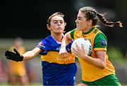 21 June 2025; Ava Walsh of Donegal in action against Clara English of Tipperary during the TG4 All-Ireland Ladies Football Senior Championship Group 1 match between Tipperary and Donegal at Canon Hayes Park in Bansha, Tipperary. Photo by Seb Daly/Sportsfile