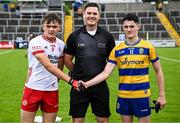 22 June 2025; Referee Chris Maguire with Tyrone captain Pádraig Donaghy and Roscommon captain Dara Curran before the Electric Ireland GAA Football All-Ireland Minor Championship semi-final match between Tyrone and Roscommon at Kingspan Breffni in Cavan. Photo by Seb Daly/Sportsfile