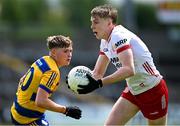 22 June 2025; Eoin Long of Tyrone in action against Christopher Feerick of Roscommon during the Electric Ireland GAA Football All-Ireland Minor Championship semi-final match between Tyrone and Roscommon at Kingspan Breffni in Cavan. Photo by Seb Daly/Sportsfile