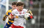 22 June 2025; Joel Kerr of Tyrone in action against Conor Tighe of Roscommon during the Electric Ireland GAA Football All-Ireland Minor Championship semi-final match between Tyrone and Roscommon at Kingspan Breffni in Cavan. Photo by Seb Daly/Sportsfile