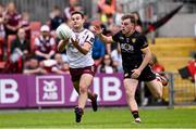 22 June 2025; Cillian McDaid of Galway in action against Ryan Magill of Down during the GAA Football All-Ireland Senior Championship preliminary quarter-final match between Down and Galway at Páirc Esler in Newry, Down. Photo by Ben McShane/Sportsfile