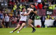 22 June 2025; Pierce Laverty of Down is tackled by Paul Conroy of Galway during the GAA Football All-Ireland Senior Championship preliminary quarter-final match between Down and Galway at Páirc Esler in Newry, Down. Photo by Ben McShane/Sportsfile